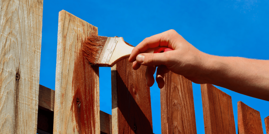 painting a fence