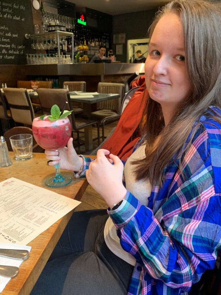 C enjoying a cocktail