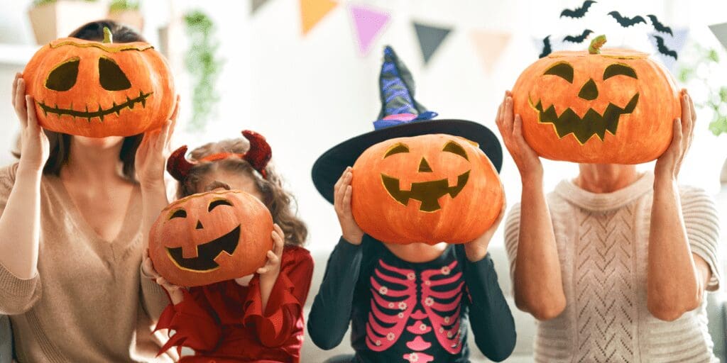 family with carved pumpkins